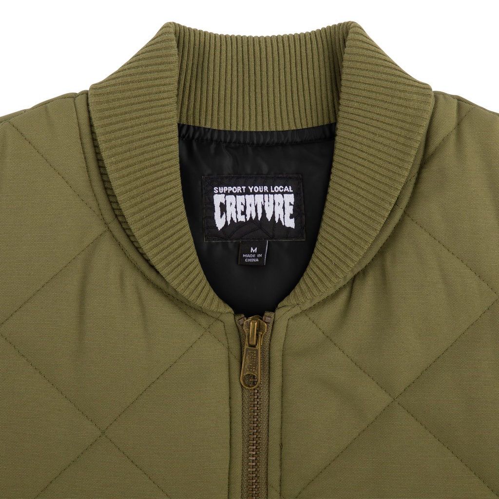 44643569-support-quilt-vest-work-top-stone-green-mens-creature-1